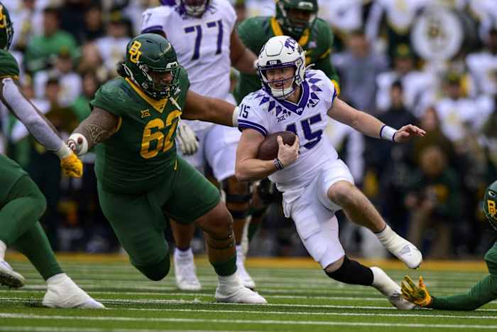 Nov 19, 2022; Waco, Texas, USA; TCU Horned Frogs quarterback Max Duggan (15) is brought down by Baylor Bears defensive lineman Siaki Ika (62) during the second half at McLane Stadium.